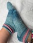 Preview: Strickkalender 2026, mit 12 Sockenstrickanleitungen und Wollsockenpaket